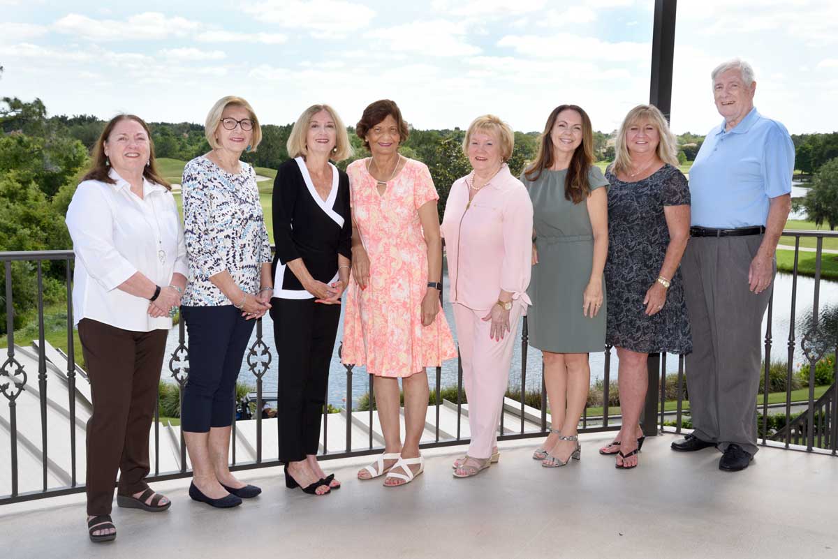 Board members standing outside