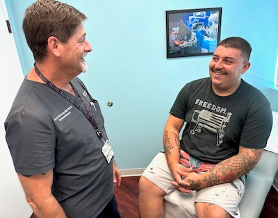 David Dexter, MD, general surgeon with his patient Taylor Butler, of East Bradenton.