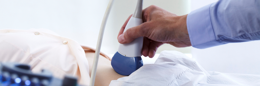 A doctor performing an ultrasound on a patient