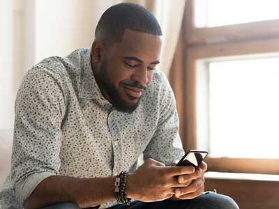 A man taking a heart risk assessment on his phone