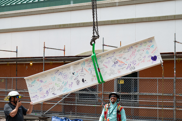 The final beam being lifted to the top