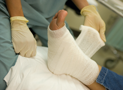 Doctor attending to foot wound