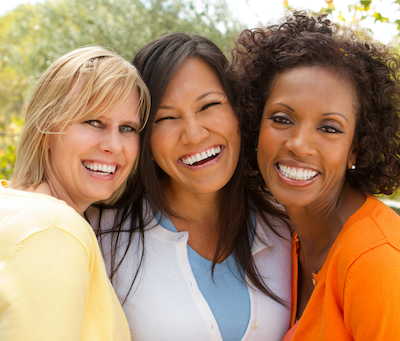 Three women smiling