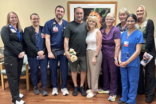 Mark Latcheran and his fiancée, Denise Allen with members of the ICU team at Lakewood Ranch Medical Center.