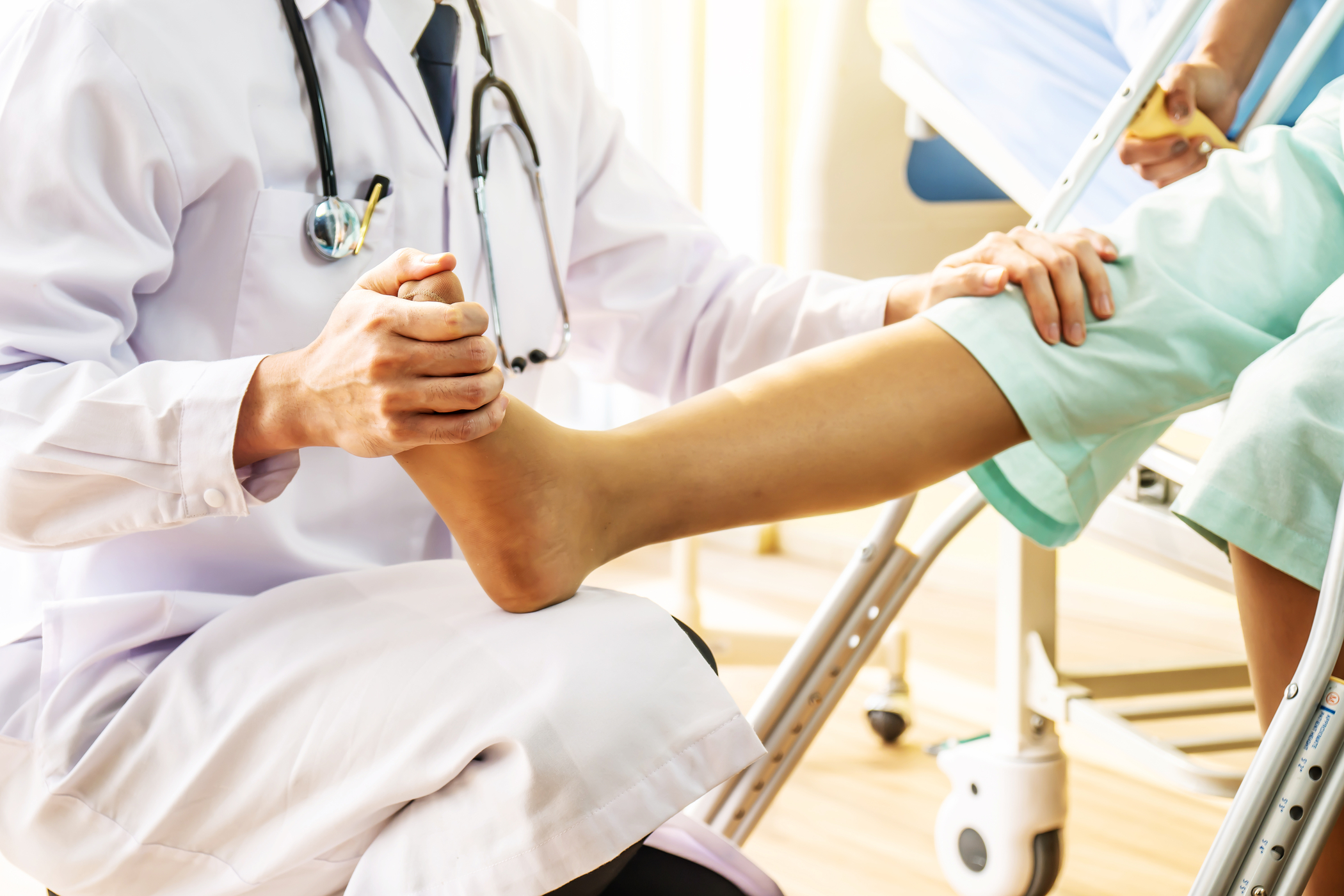 physician treating foot and ankle pain