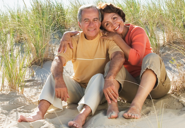 Man and woman sitting on the beach