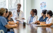 Doctor speaking to the nursing staff